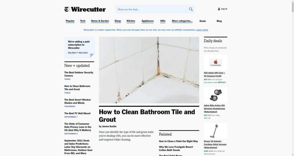 Screenshot of the Wirecutter homepage, with categories across the top of Popular, Tech, Home & Garden, Sleep, Kitchen, Appliances, Gifts, More Categories, Deals. The main article is titled "How to Clean Bathroom Tile and Grout," and features a picture of white tile with dirty grout.