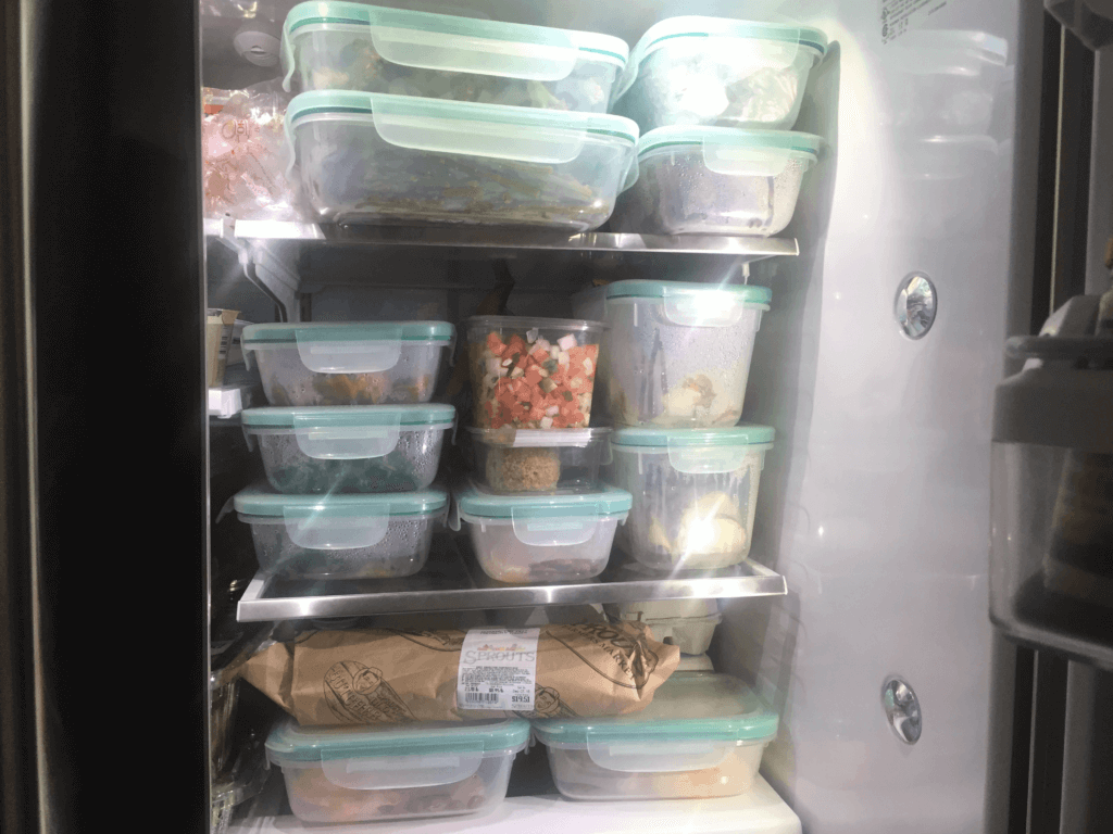 Photo of fridge packed with meal prep containers