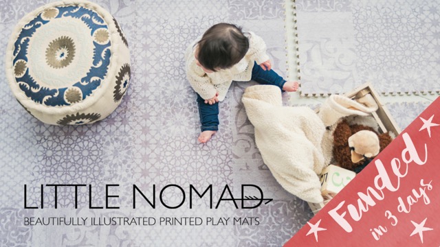An overhead picture of a little toddler girl sitting on a play mat with a white lace print. The text reads "Little Nomad: Beautifully illustrated printed play mats" and a corner overlay reads "Funded in three days."