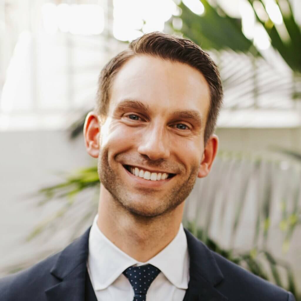 Headshot of Derek Miller, smiling