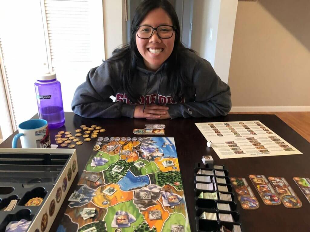 Nalin posing with board game