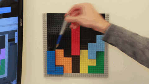Brik tile with shapes like Tetris making a pen cup and a lip gloss shelf.