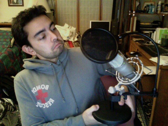 Photo of Pat with microphone and pop filter