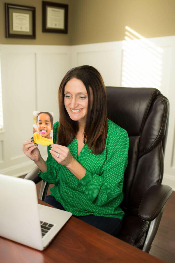 rose griffing holding card computer teaching