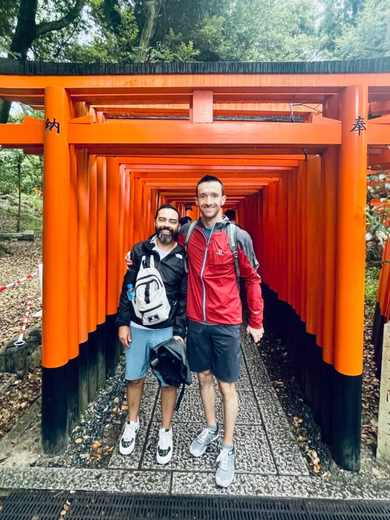 Matt and Pat Flynn in Japan in front of red gates