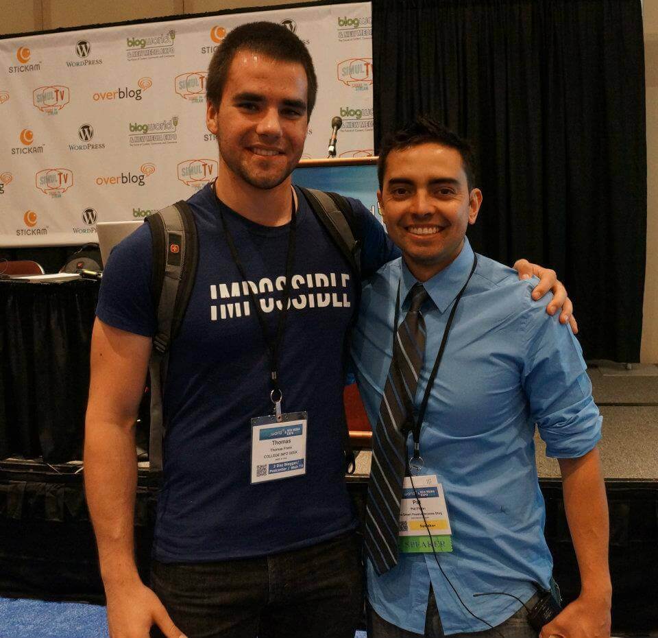 Pat Flynn and Thomas Frank at BlogWorld 2012, smiling and looking at camera wearing lanyards