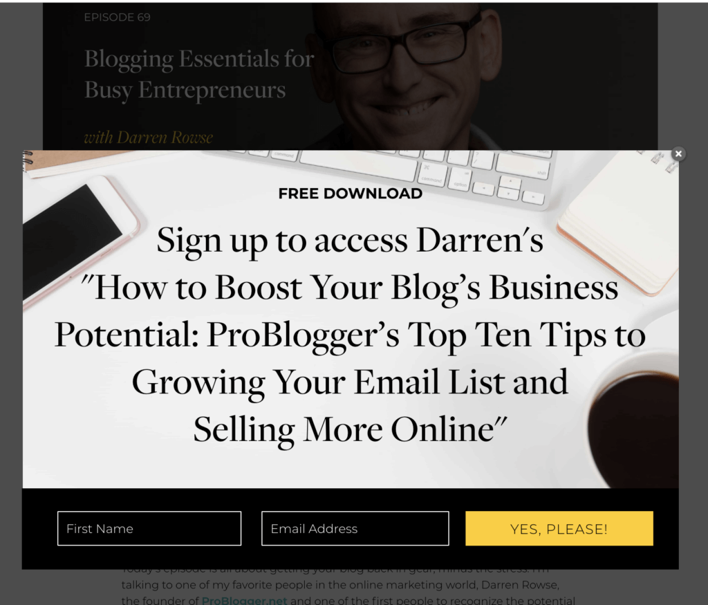 An example of an email marketing content upgrade from Amy Porterfield. On the page for the podcast episode, there is a pop-up that reads "Free Download: Sign up to access Darren's [the episode guest] 'How to Boost Your Blog's Business Potential: ProBlogger's Top Ten Tips to Growing Your Email List and Selling More Online.'"