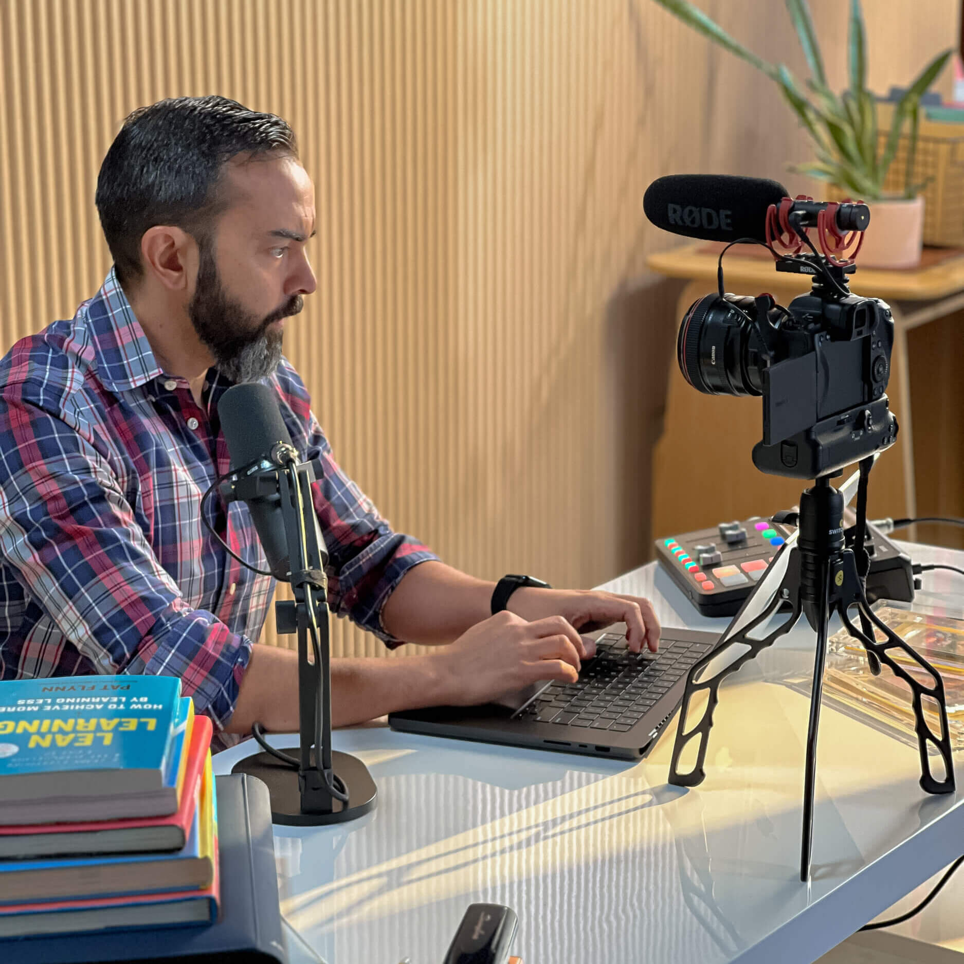 Pat filming a YouTube video with a camera on a Switchpod tripod